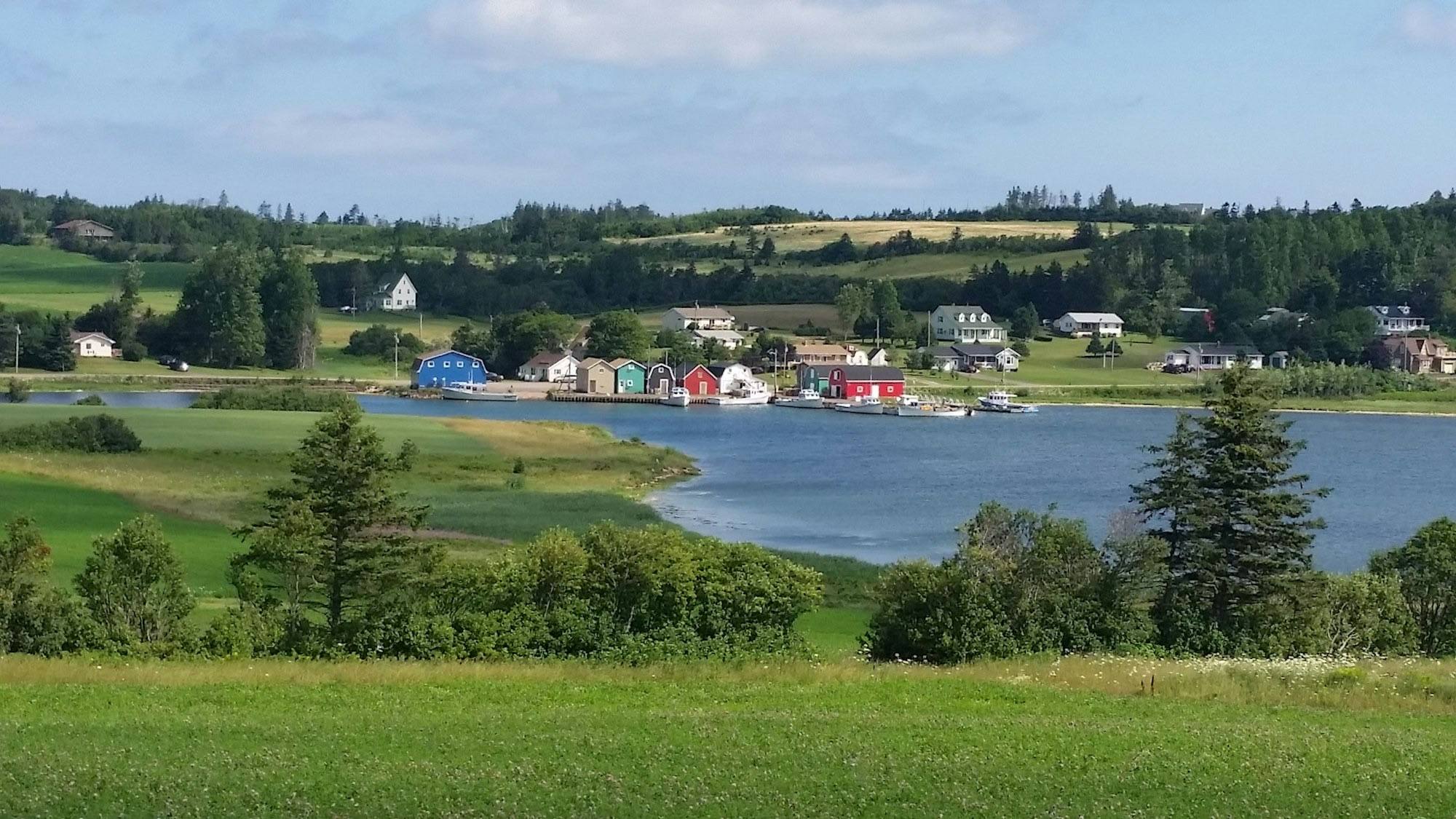 A Prince Edward Island cove with colourful boathouses